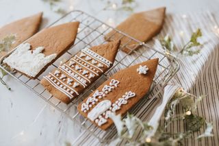 Christmas gingerbread house parts on cooling rack