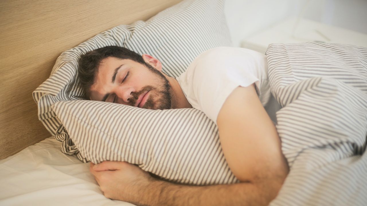 Man asleep in bed