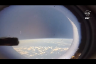 A view out the window of Orion during re-entry of Artemis 1 on Dec. 11, 2022.