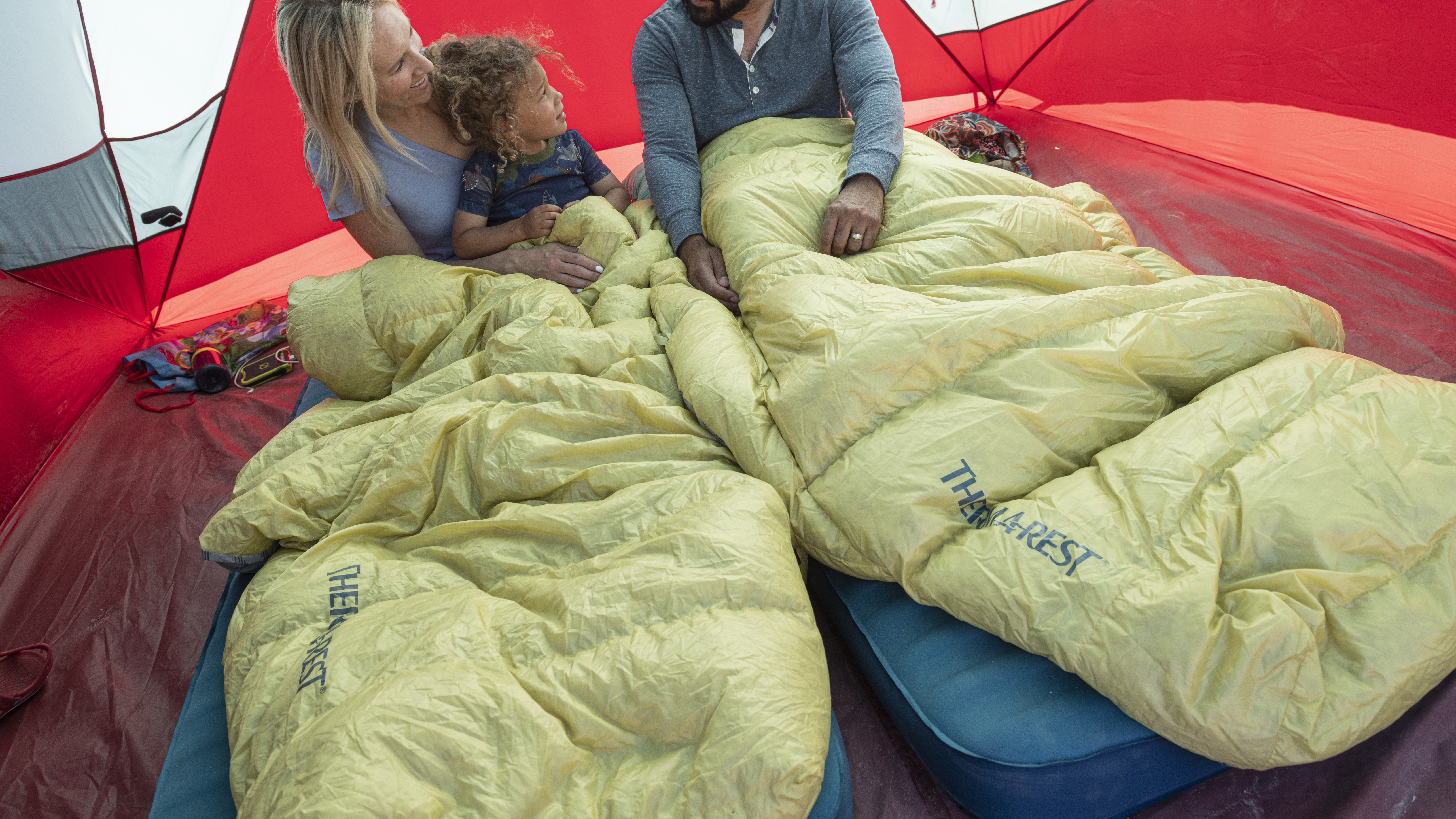 A family of campers using the Therm-a-Rest NeoLoft pad