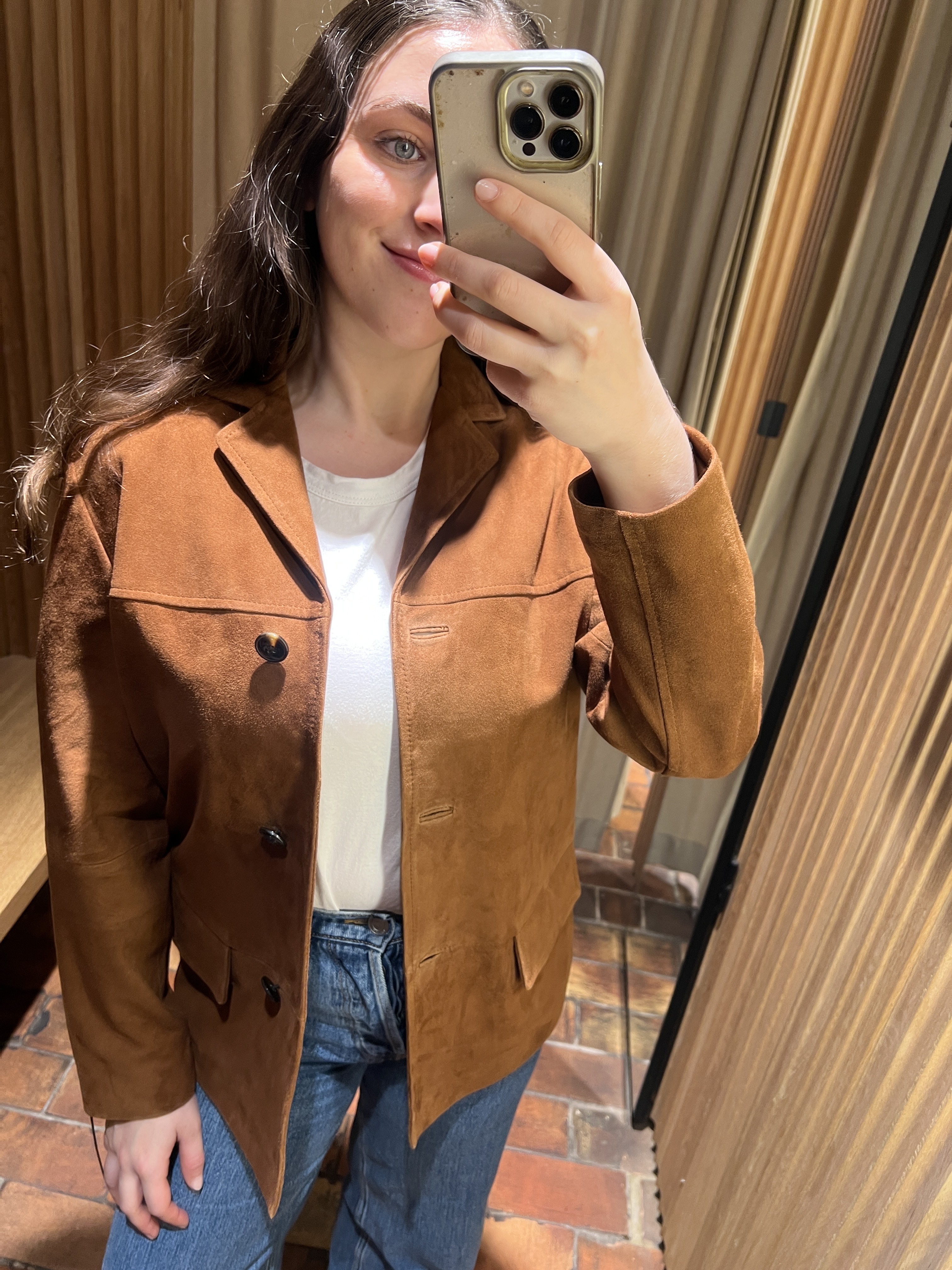 An image of @avahgilchrist trying on a Mango suede blazer.