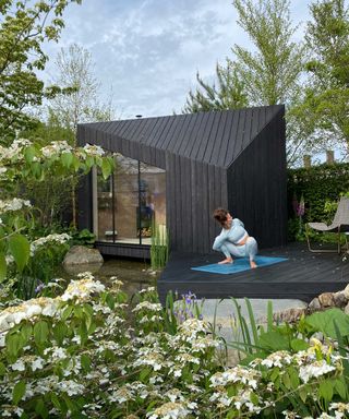 wellness garden with garden building and yoga at chelsea flower show 2022