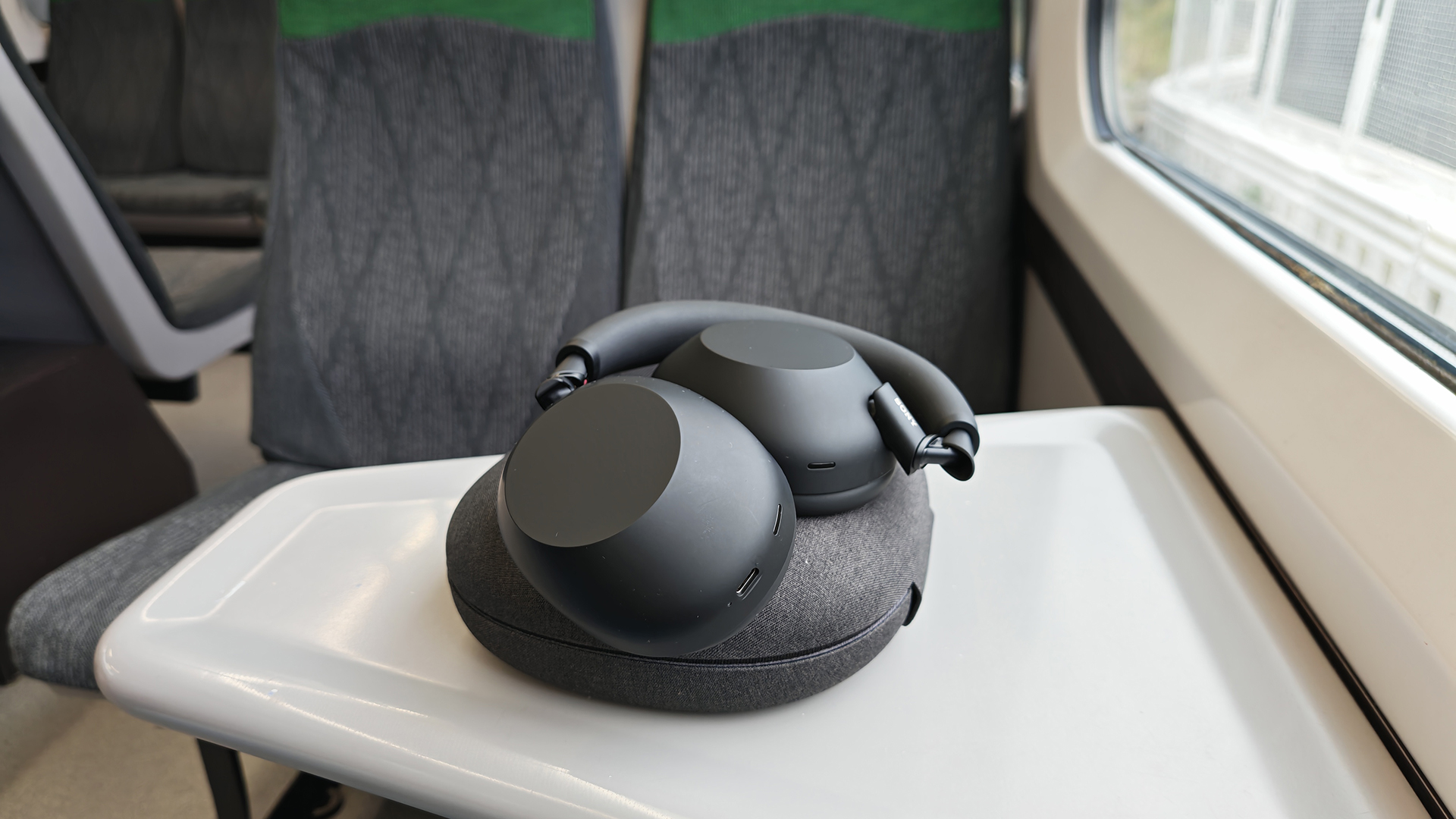 Th Sony XM6s on a train table. 