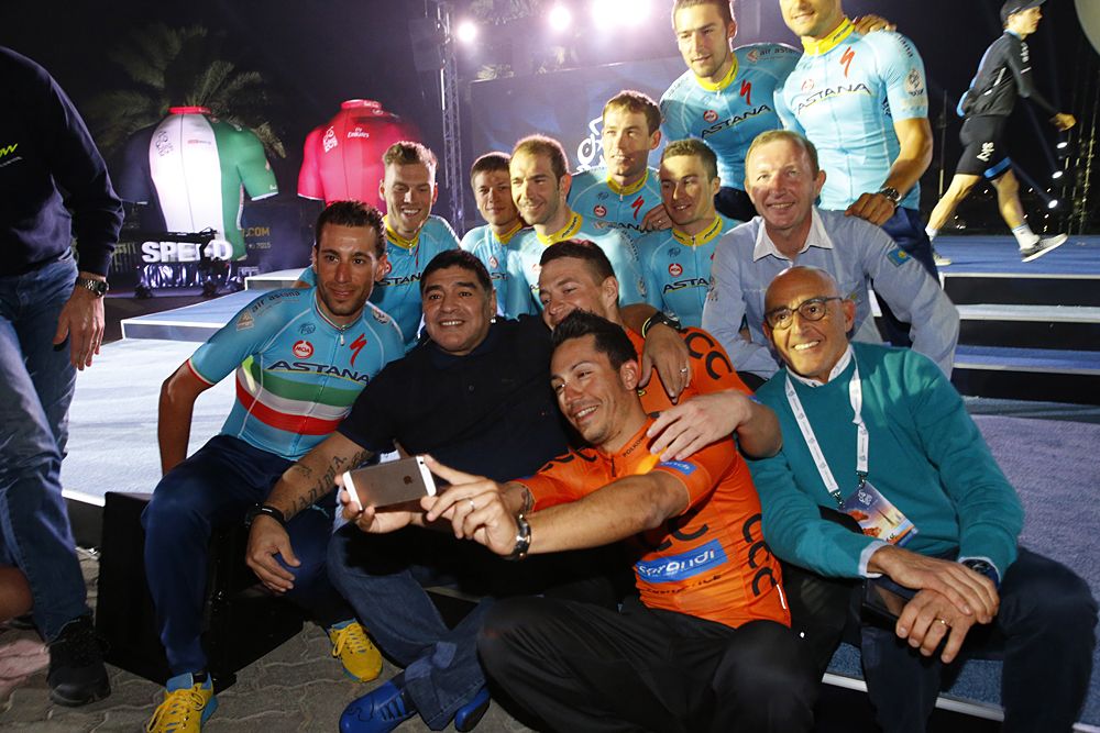 Riders pile in to pose with Diego Maradona