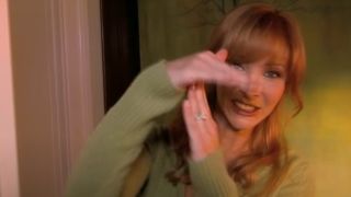 Valerie Cherish (Lisa Kudrow) gives the "time out" signal on an episode of The Comeback.