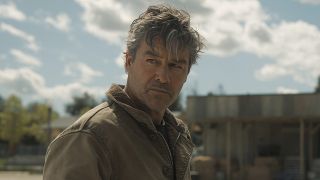 Hal Jordan (Kyle Chandler) looks over at something or someone on Lanterns.