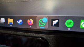 A photo of the WhatsApp logo displayed on a screen