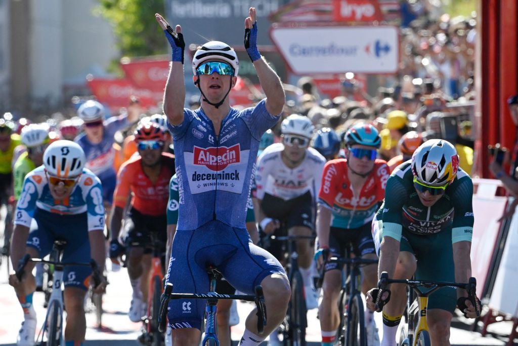 Team Alpecin's Kaden Groves celebrates crossing the finish in first place at the end of the stage 2 of La Vuelta a Espana cycling tour, a 194 km race between Cascais and Ourem, on August 18, 2024. (Photo by MIGUEL RIOPA / AFP)