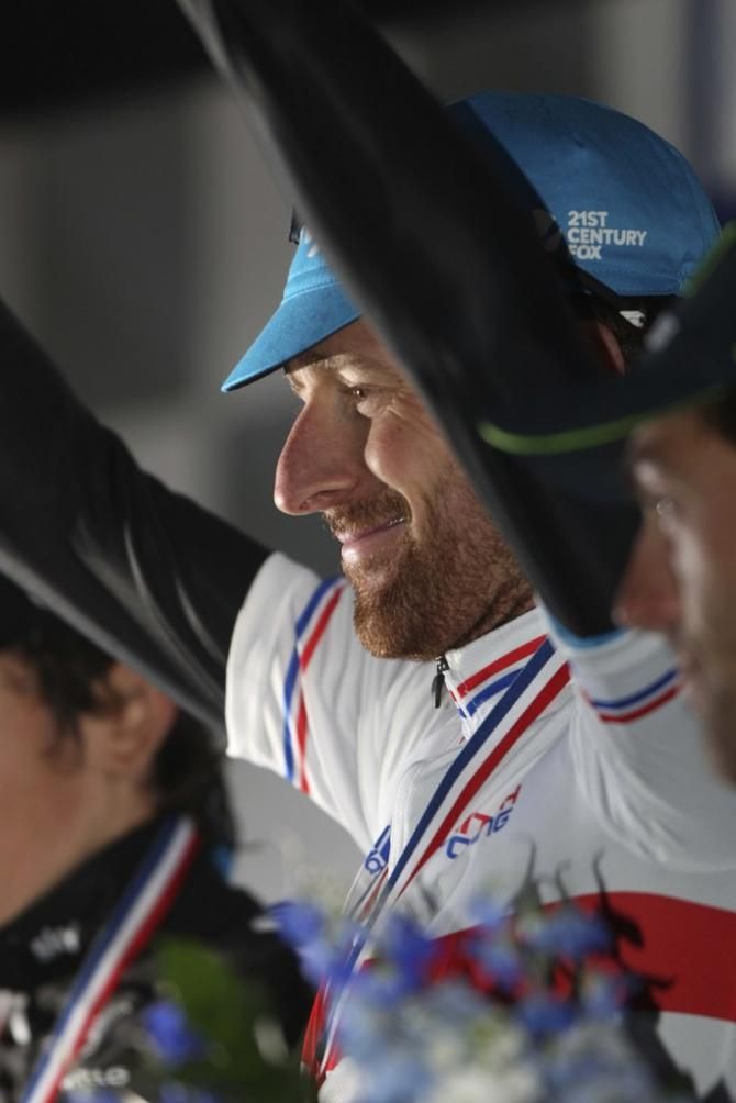 Bradley Wiggins on the podium after claiming the time trial win