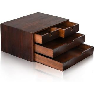 A set of dark stained bamboo desktop drawers