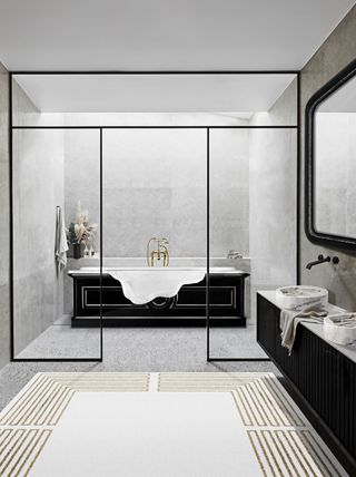 A bathroom with sleek shower doors in black