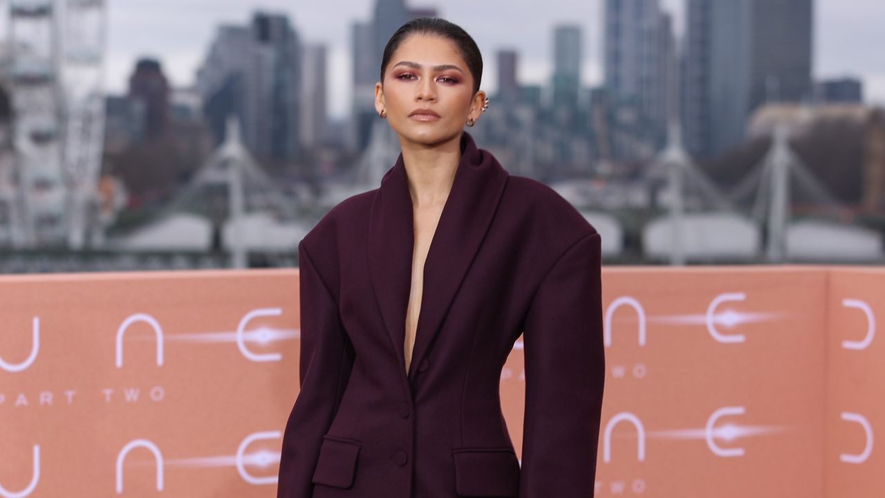 Zendaya wearing a plum suit to a Dune: Part Two photocall