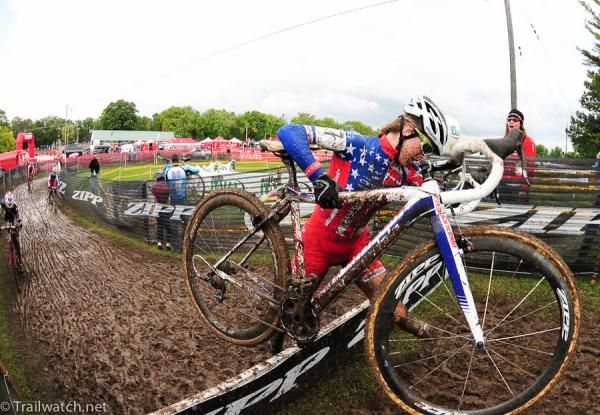 Kaitlin Antounneau (Cannondale pb Cyclorossworld.com) barely clearing her bike over the barriers