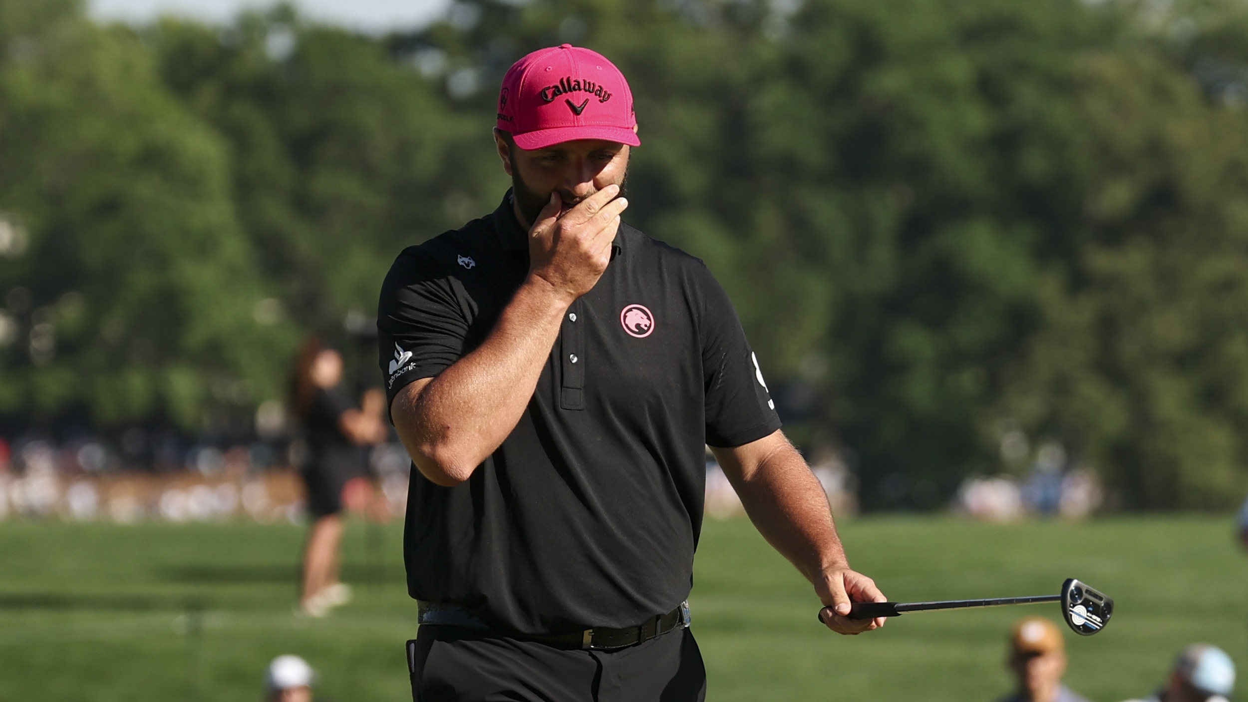 Jon Rahm with his putter