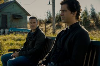MIDNIGHT MASS (L to R) ZACH GILFORD as RILEY FLYNN and HAMISH LINKLATER as FATHER PAUL in episode 102 of MIDNIGHT MASS