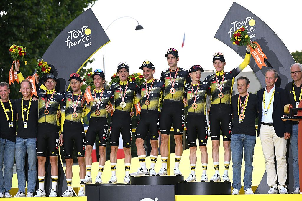 PARIS - CHAMPS-ELYSEES, FRANCE - JULY 27: A general view of Jonas Vingegaard of Denmark, Victor Campenaerts of Belgium, Edoardo Affini of Italy, Tiesj Benoot of Belgium, Matteo Jorgenson of United States, Sepp Kuss of United States, Wout Van Aert of Belgium, Simon Yates of Great Britain and Team Visma | Lease a Bike celebrate at podium as best team during the 112th Tour de France 2025, Stage 21 a 132.3km stage from Mantes-la-Ville to Paris - Champs-Elysees / #UCIWT / on July 27, 2025 in Paris - Champs-Elysees, France.