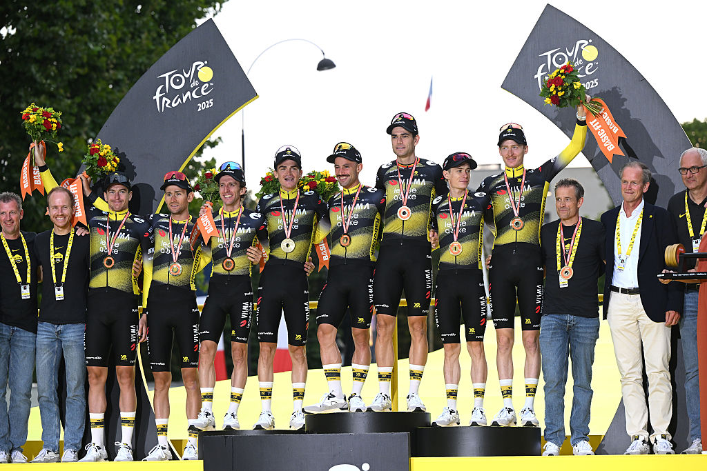 PARIS - CHAMPS-ELYSEES, FRANCE - JULY 27: A general view of Jonas Vingegaard of Denmark, Victor Campenaerts of Belgium, Edoardo Affini of Italy, Tiesj Benoot of Belgium, Matteo Jorgenson of United States, Sepp Kuss of United States, Wout Van Aert of Belgium, Simon Yates of Great Britain and Team Visma | Lease a Bike celebrate at podium as best team during the 112th Tour de France 2025, Stage 21 a 132.3km stage from Mantes-la-Ville to Paris - Champs-Elysees / #UCIWT / on July 27, 2025 in Paris - Champs-Elysees, France.