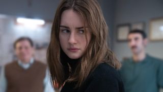 Grace Van Patten as Amanda Knox in The Twisted Tale of Amanda Knox looking scared.