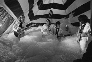 The Rolling Stones pose during the production of their music video for 'It's Only Rock 'n Roll (But I Like It)' in June 1974 in London, England. The video was directed by Michael Lindsay-Hogg