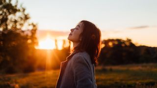 Sounds for mental health, Woman Taking A Breath Of Fresh Air In Nature