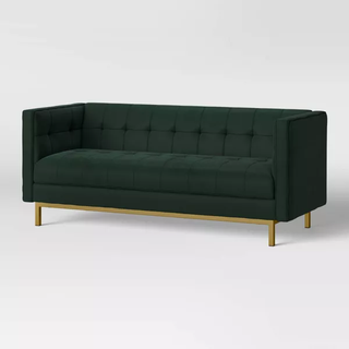 tuxedo-style green velvet loveseat