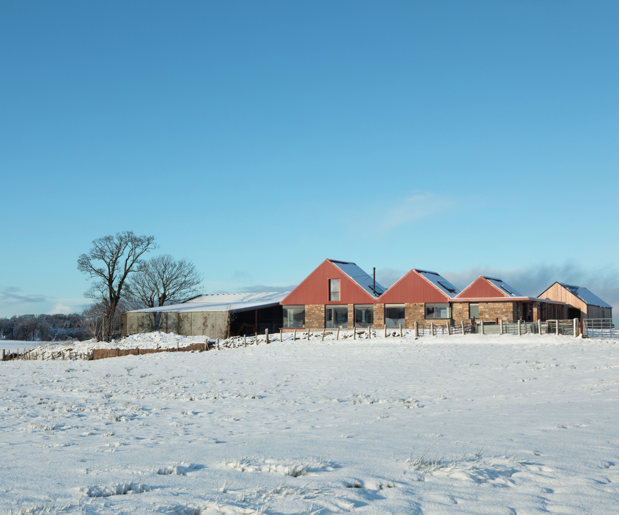 winter scene showing home build on plot that was previously brownfield land