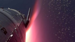 View of a SpaceX Flight 5 spaceship re-entering Earth's atmosphere, with red glowing plasma surrounding it.