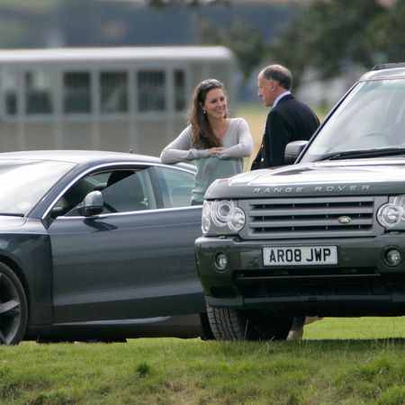 Princess Kate talking to Jamie Lowther-Pinkerton in front of two cars