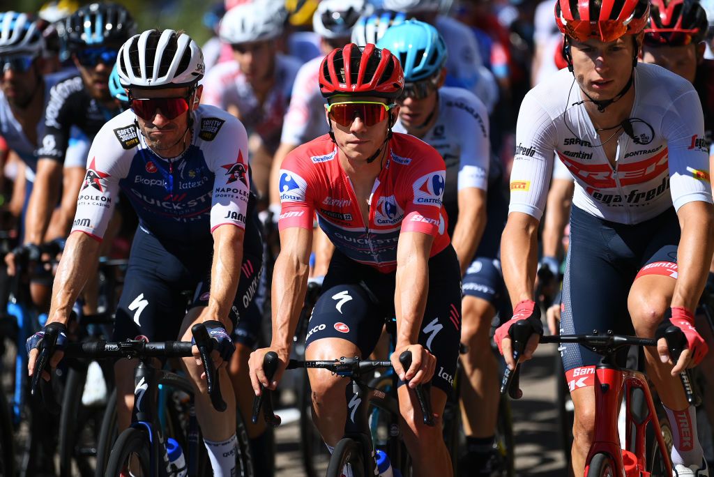 TALAVERA DE LA REINA SPAIN SEPTEMBER 09 LR Dries Devenyns of Belgium Remco Evenepoel of Belgium and Team QuickStep Alpha Vinyl Red Leader Jersey and Alex Kirsch of Luxembourg and Team Trek Segafredo compete during the 77th Tour of Spain 2022 Stage 19 a 1383km stage from Talavera de la Reina to Talavera de la Reina LaVuelta22 WorldTour on September 09 2022 in Talavera de la Reina Spain Photo by Justin SetterfieldGetty Images