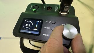 Neewer AS600B video light control dial being turned