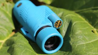 A blue Nocs Provisions 8X32 Field Tube monocular