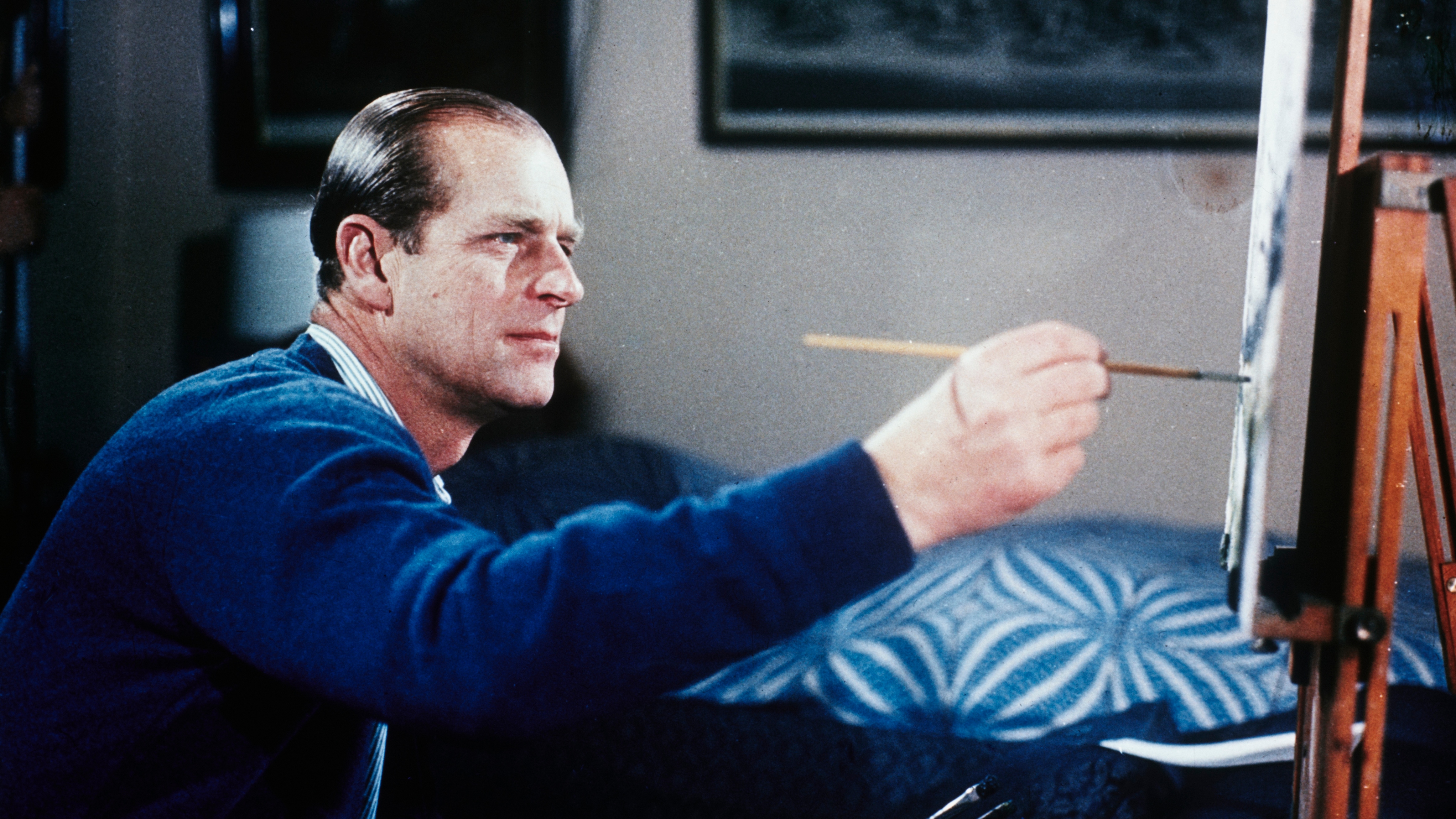 Prince Philip painting during the filming of the joint ITV-BBC documentary 'The Royal Family' at Sandringham House in Norfolk