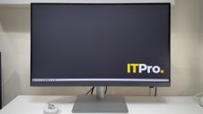 The BenQ PD3226G monitor on a desk