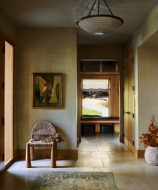 beige living room with modern chair