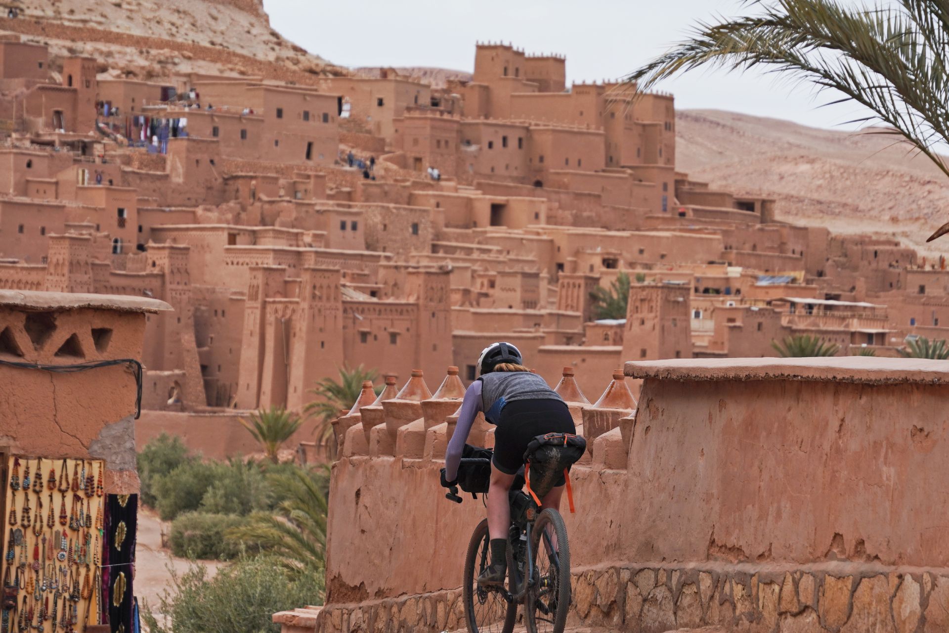 Image shows Anna cycling towards Aït Benhaddou