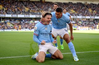 Man City star Jack Grealish celebrates with Rodri after scoring their side's first goal during the Premier League match between Wolverhampton Wanderers and Manchester City at Molineux on September 17, 2022 in Wolverhampton, England.