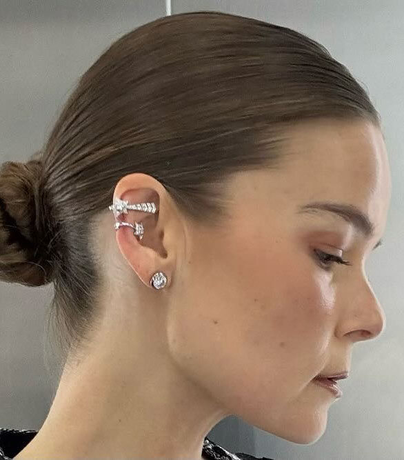 A woman with diamond earrings
