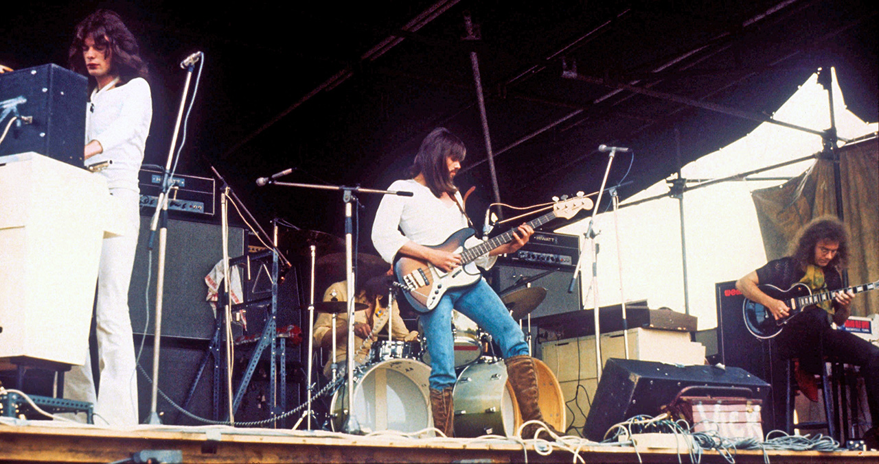 King Crimson perform live on stage at the Hyde Park Free Concert in London on 4th September 1971. L-R: Mel Collins, Boz Burrell, Robert Fripp. (Photo by Michael Putland/Getty Images)
