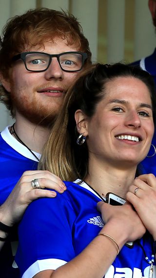 Ed Sheeran and fiance Cherry Seaborn look on during the Sky Bet Championship match