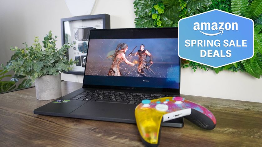 Asus ROG Zephyrus G16 on table with game controller resting on it with Amazon Spring Sale Deals badge