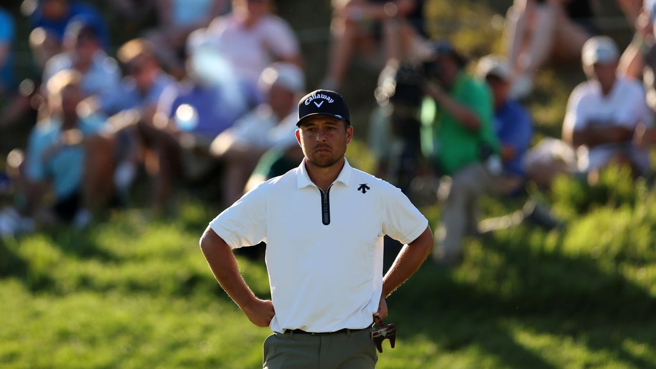 Xander Schauffele stands with both hands on his hips at the 2024 PGA Championship