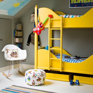 kids room with bunk bed and ladder with pouffe