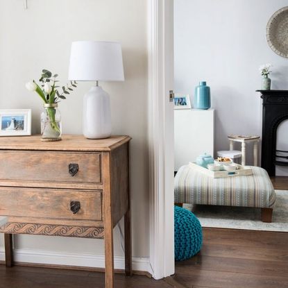 drawer cabinet with flower vase and lamp