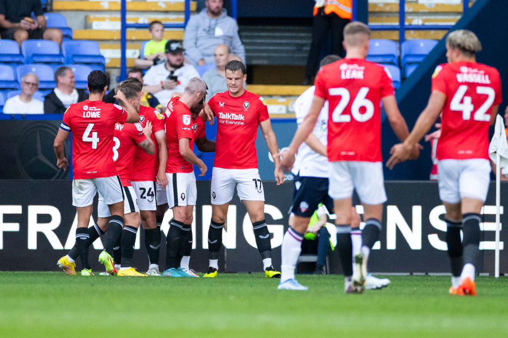 Salford City celebrate Brandon Thomas-Asante (10) of Salford City making it 0-1Brandon Thomas-Asante (10) of Salford City during the Carabao Cup match between Bolton Wanderers and Salford City at the University of Bolton Stadium, Bolton on Tuesday 9th August 2022.