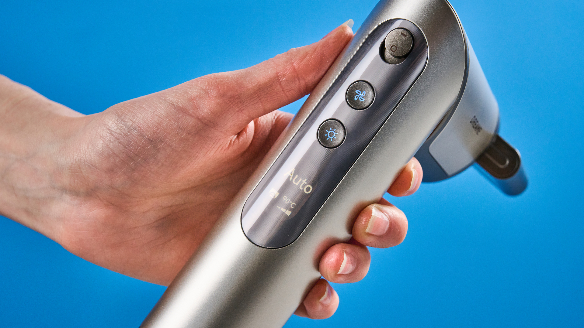 Dreame Dazzle air styler photographed in front of a blue background