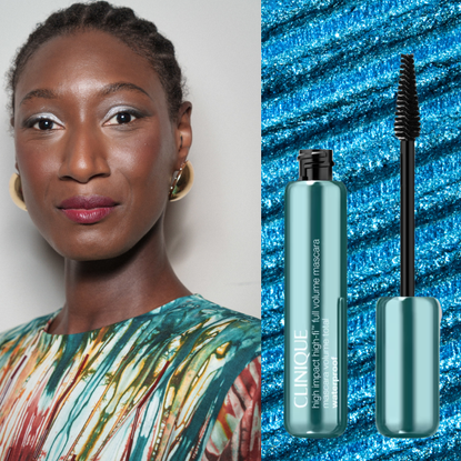 A woman wearing cornrows, white eyeshadow, and mascara next to a tube of mascara. 