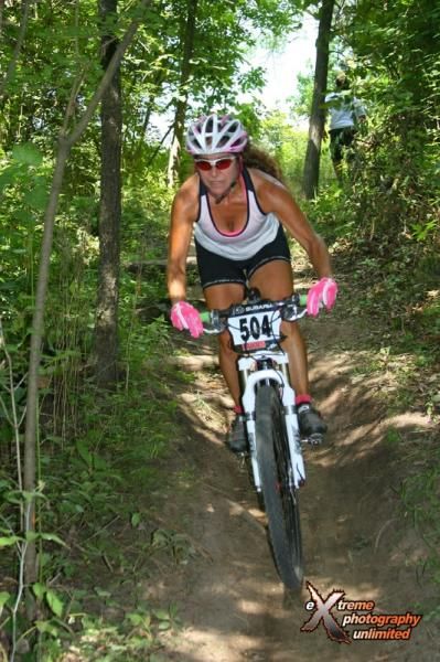 Lori Sable of Thiensville, WI, who rode to a solid second place aboard a friend's borrowed Trek Top Fuel, raved about the full suspension ride after crossing the finish line for her best result of the year so far. Photo by Extreme Photography.