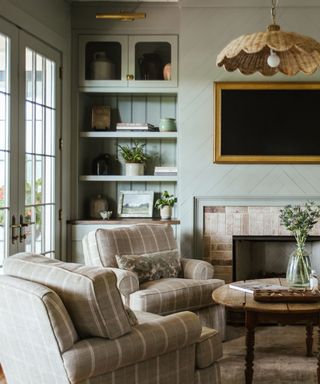 muted sage green living room space by the misfit house