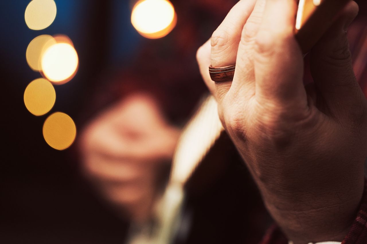 A guitarist wears one of Fender's new wedding rings on his left hand