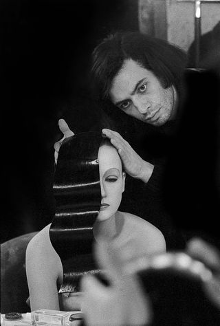 Serge Lutens at work in the early days of his career working on a model head.